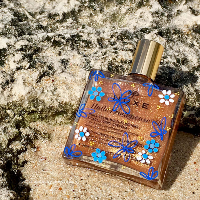 My bottle of Nuxe Huile Prodigieuse Or, also illustrated by artist Chris J Nevin