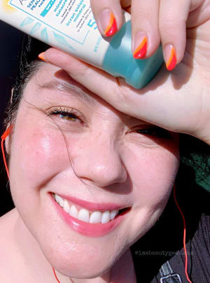 Just re-applied Aveeno SPF 50 mineral sunscreen while lounging at the back of a city-tour bus in Lisbon
