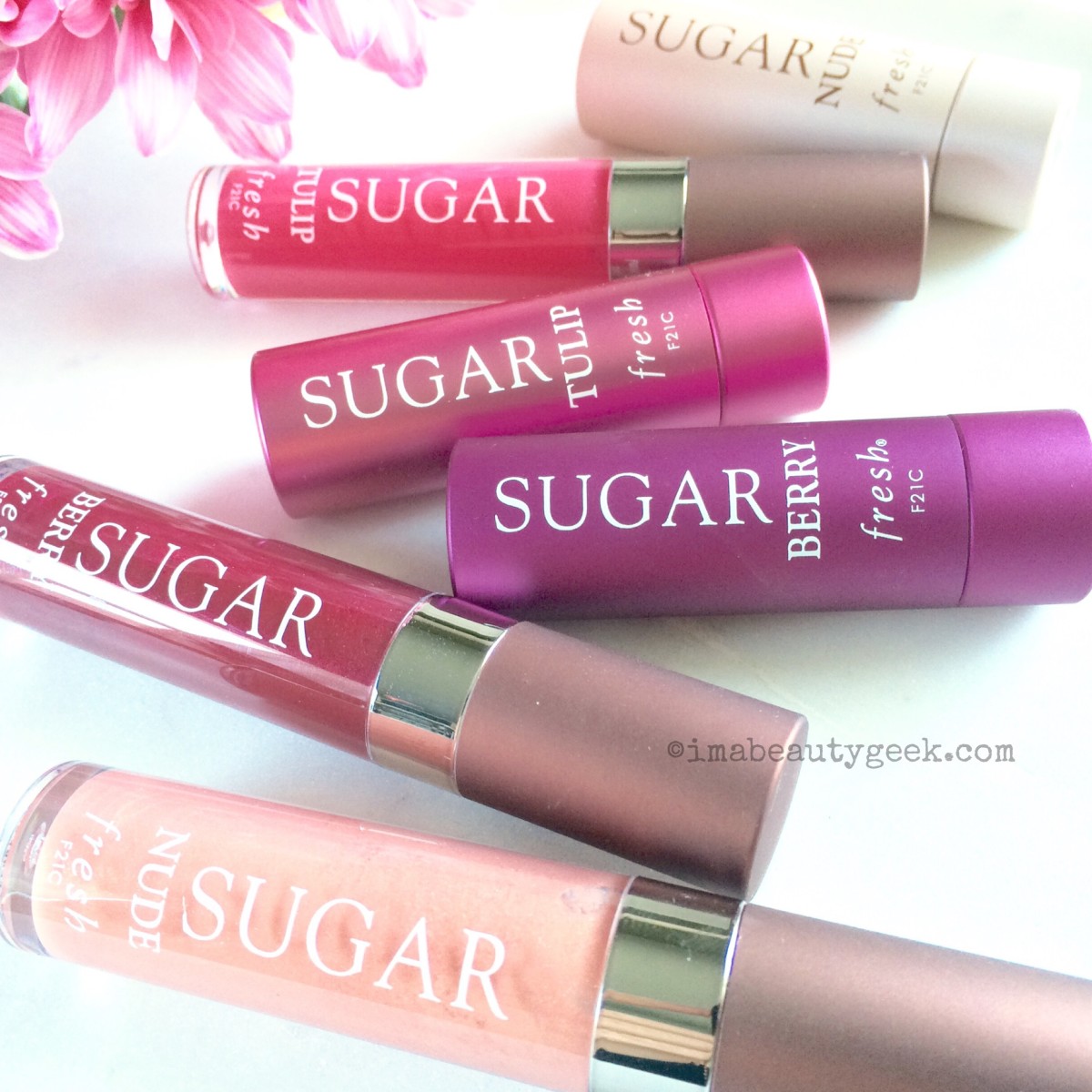 Summer lip gloss Fresh Sugar Shine Lip Treatment and corresponding Sugar lip balms 